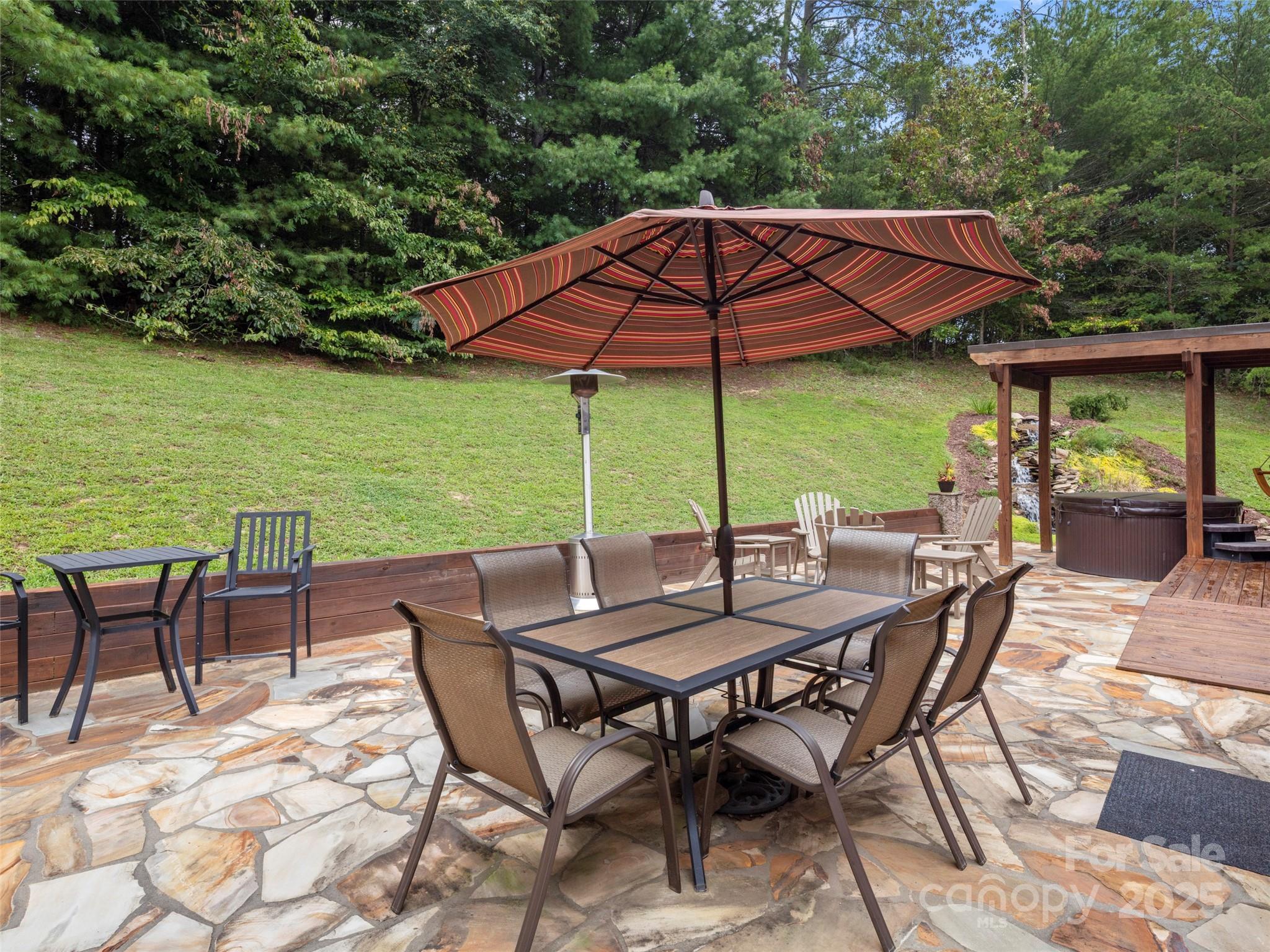 298 Lone Pine Road Alexander, NC 28701 - Photo 36 of 48 an outdoor space with furniture and umbrella