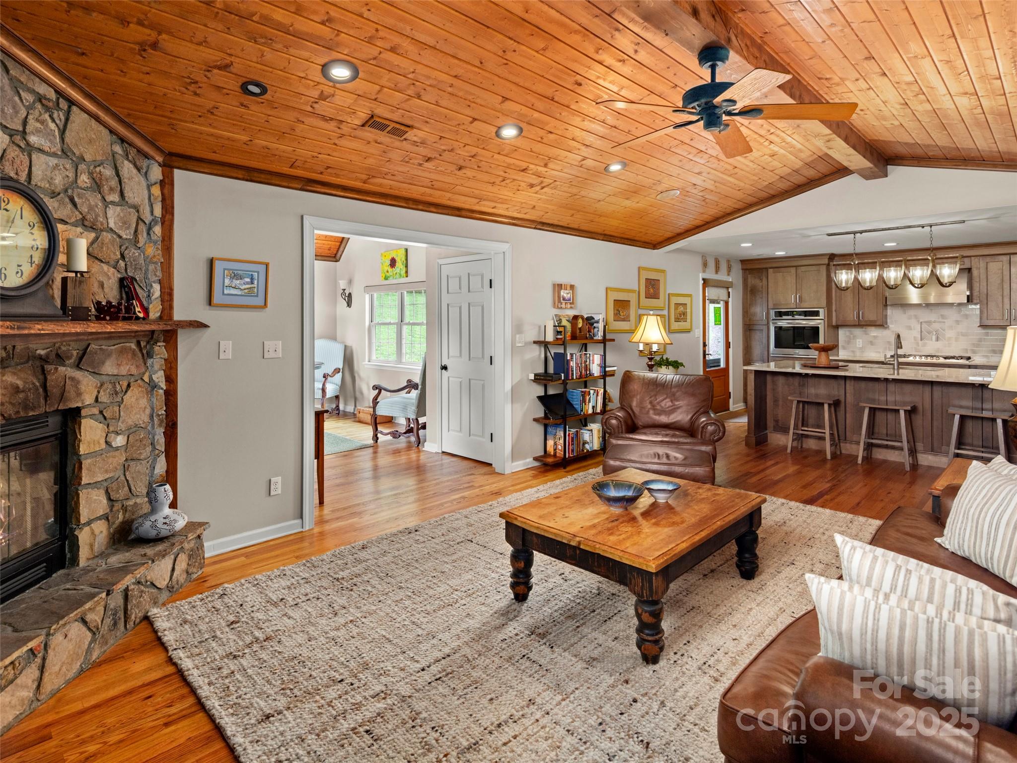 298 Lone Pine Road Alexander, NC 28701 - Photo 8 of 48 a living room with furniture a rug and a flat screen tv