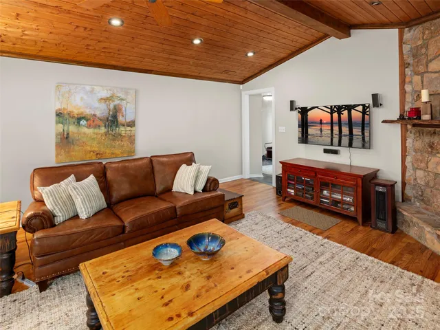 a living room with furniture and a rug