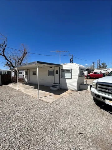 a house view with a backyard space