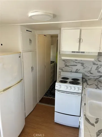 a view of a kitchen with washer and dryer