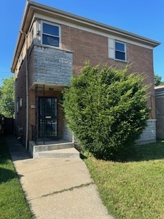608 West 95th Street Chicago, IL 60628 - Photo 1 of 3 a front view of a house with a yard