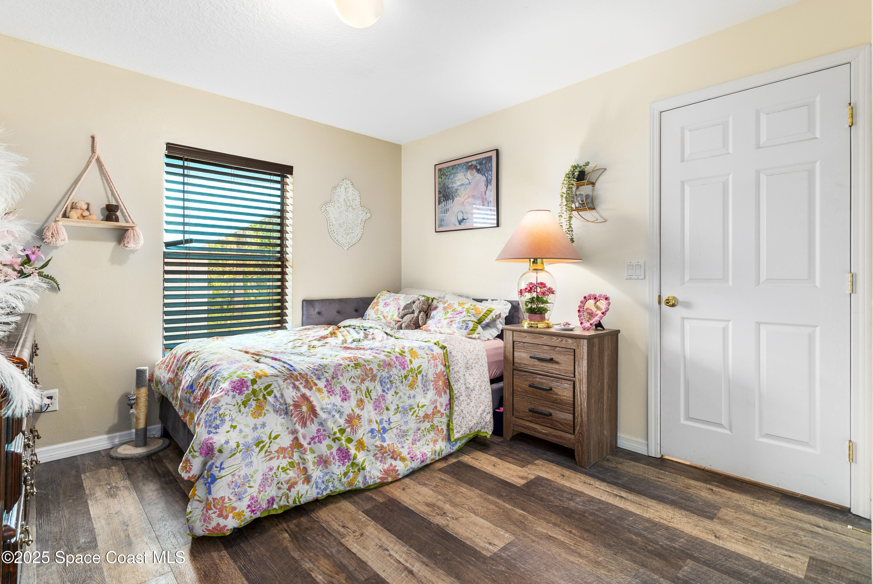 5964 Travis Street Mims, FL 32754 - Photo 12 of 45 a bedroom with a bed and a window