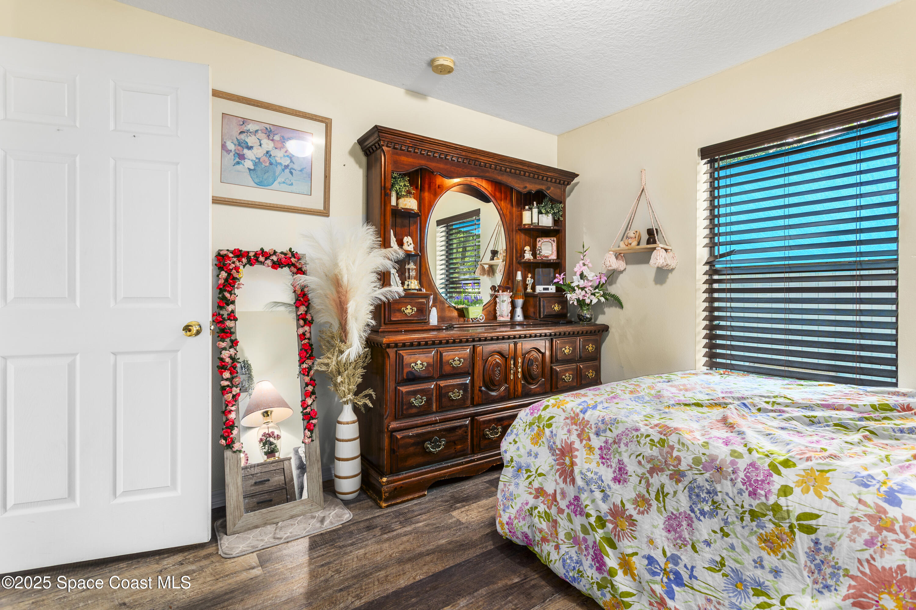 5964 Travis Street Mims, FL 32754 - Photo 13 of 45 a bedroom with a bed and a window