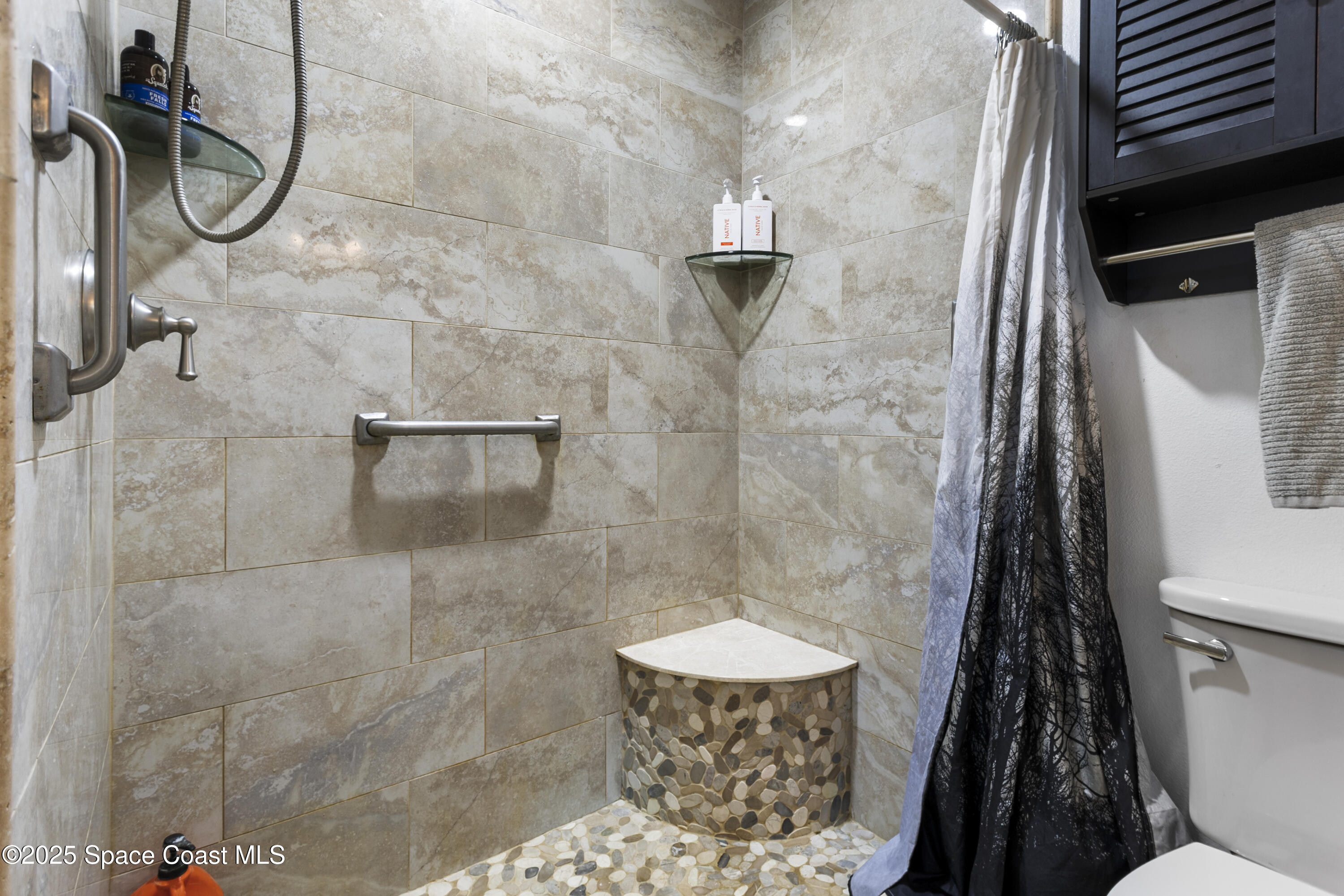 5964 Travis Street Mims, FL 32754 - Photo 17 of 45 a bathroom with a shower