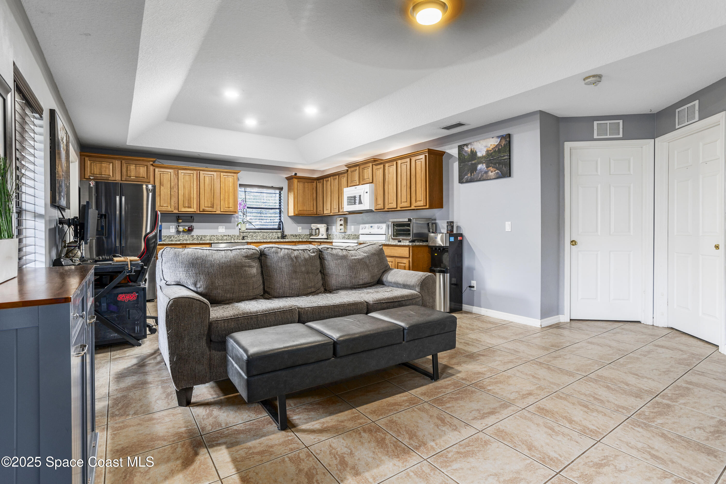 5964 Travis Street Mims, FL 32754 - Photo 21 of 45 a living room with furniture and a window