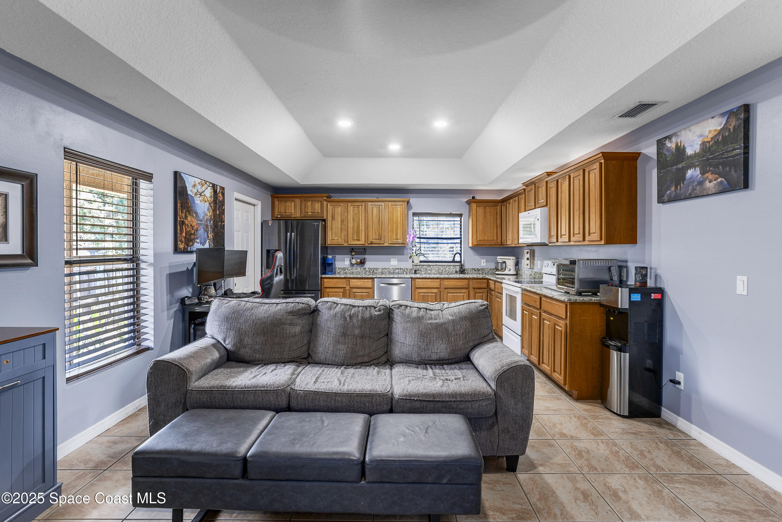 5964 Travis Street Mims, FL 32754 - Photo 22 of 45 a living room with furniture and a large window