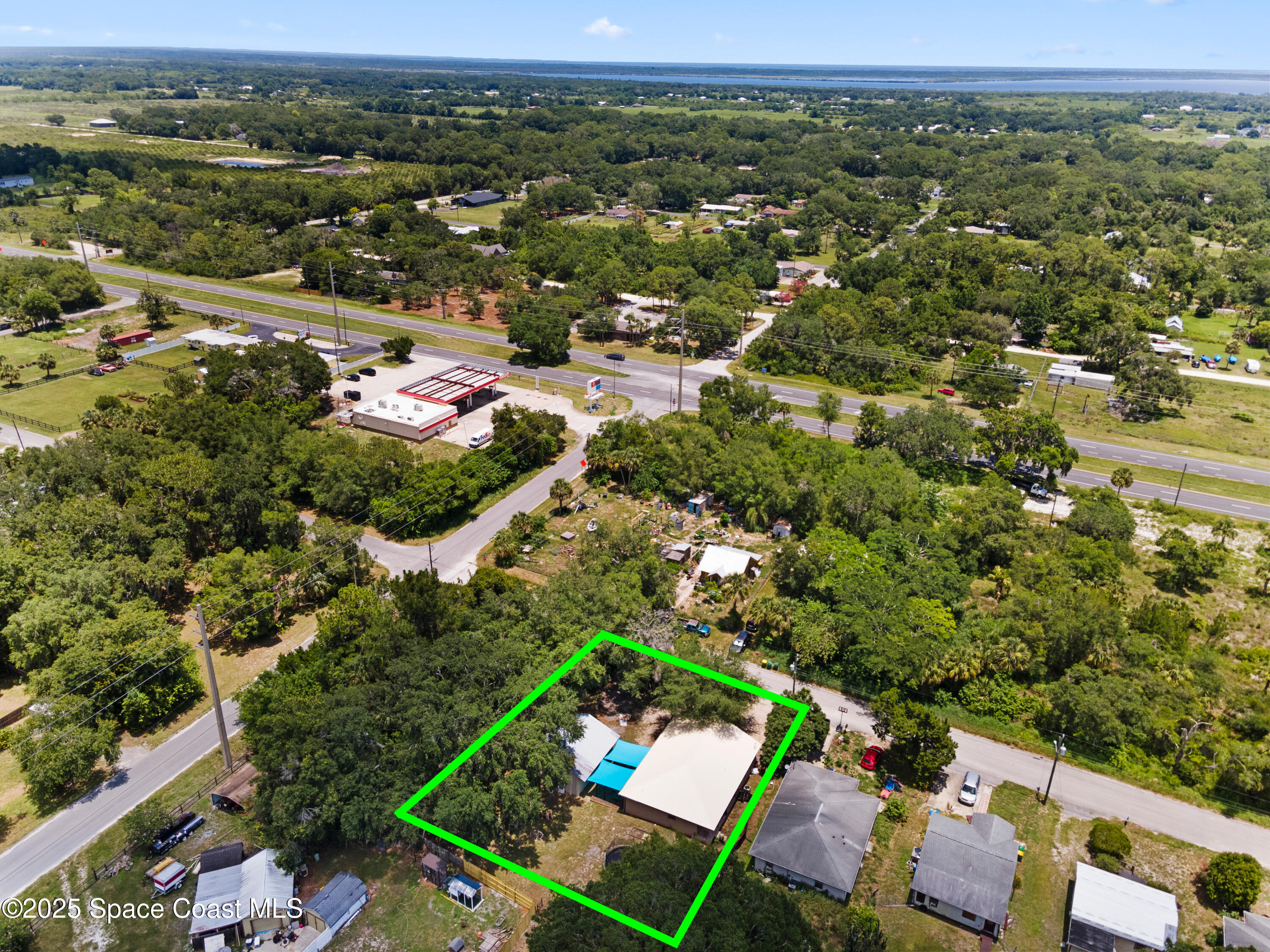 5964 Travis Street Mims, FL 32754 - Photo 28 of 45 an aerial view of a city with lots of residential buildings