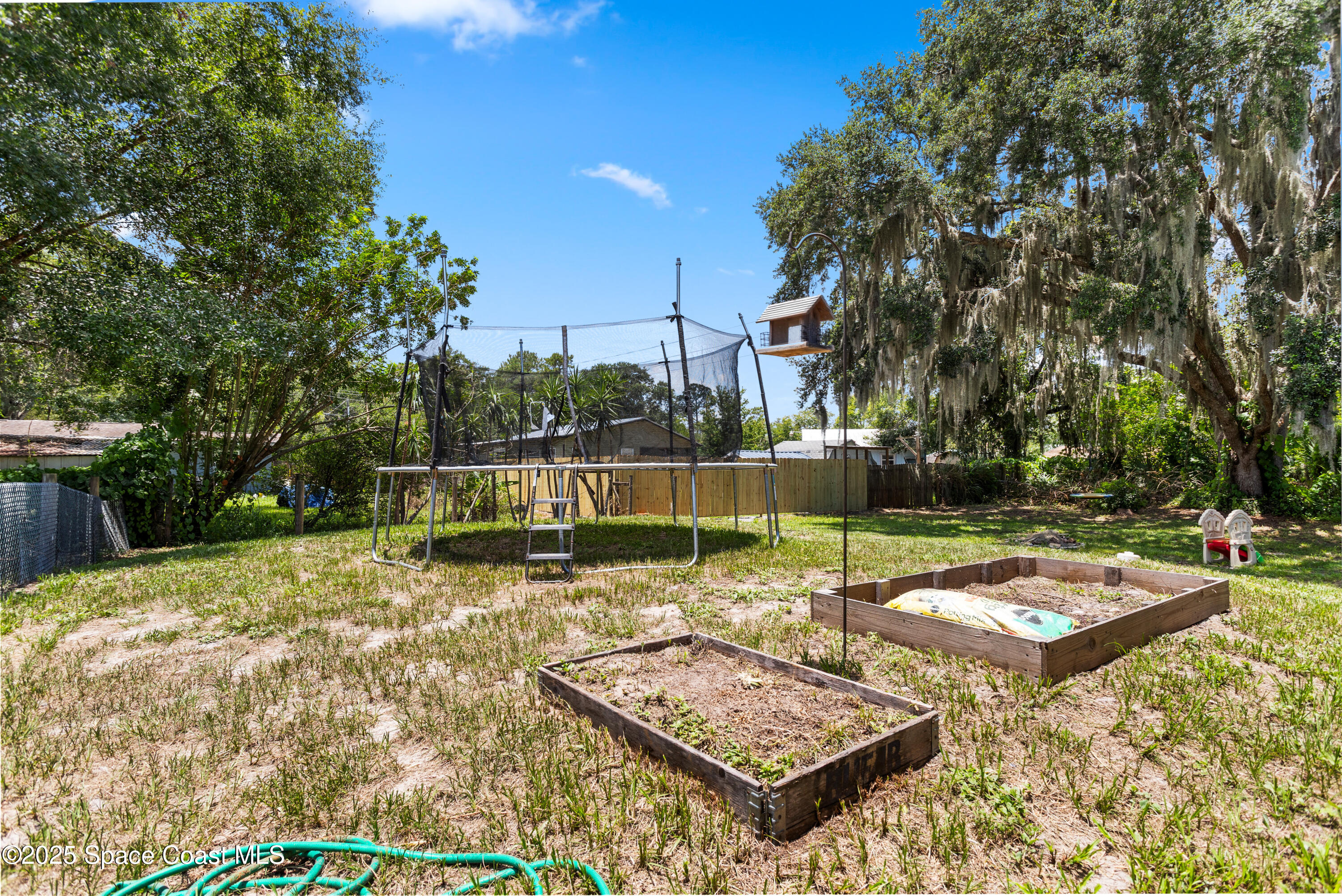 5964 Travis Street Mims, FL 32754 - Photo 34 of 45 a view of a backyard with swimming pool