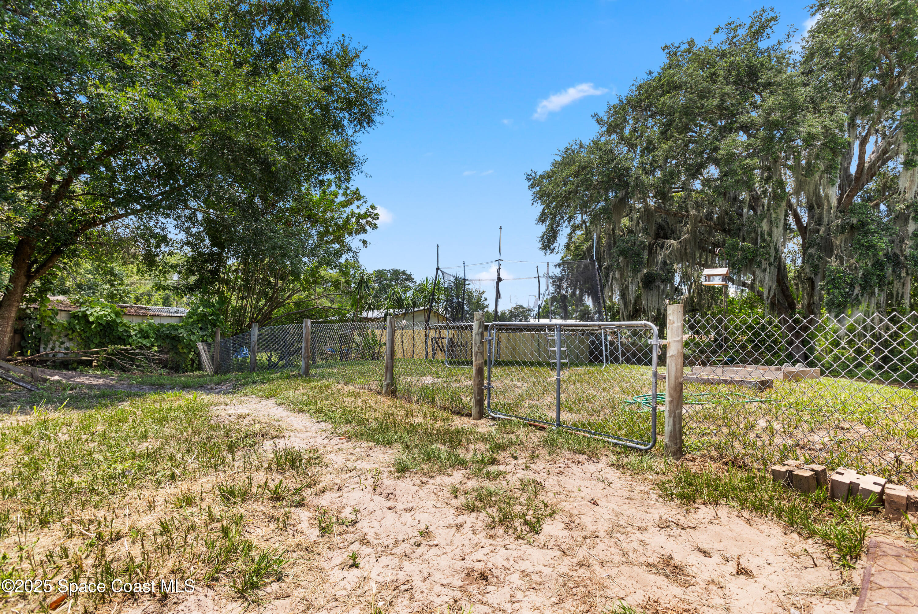 5964 Travis Street Mims, FL 32754 - Photo 35 of 45 a view of a yard with a slide