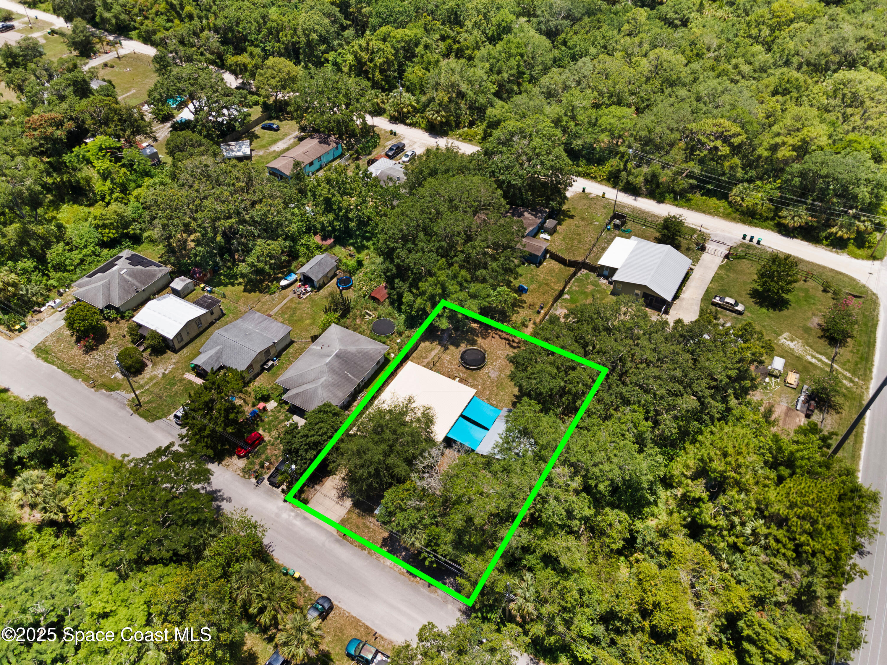 5964 Travis Street Mims, FL 32754 - Photo 38 of 45 an aerial view of a house with a yard
