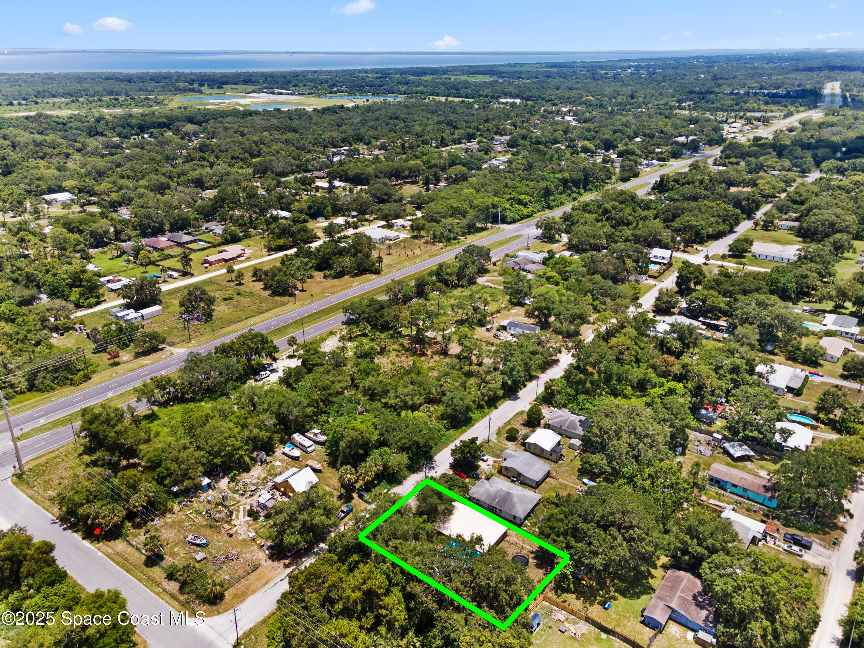 5964 Travis Street Mims, FL 32754 - Photo 42 of 45 an aerial view of a city and mountain
