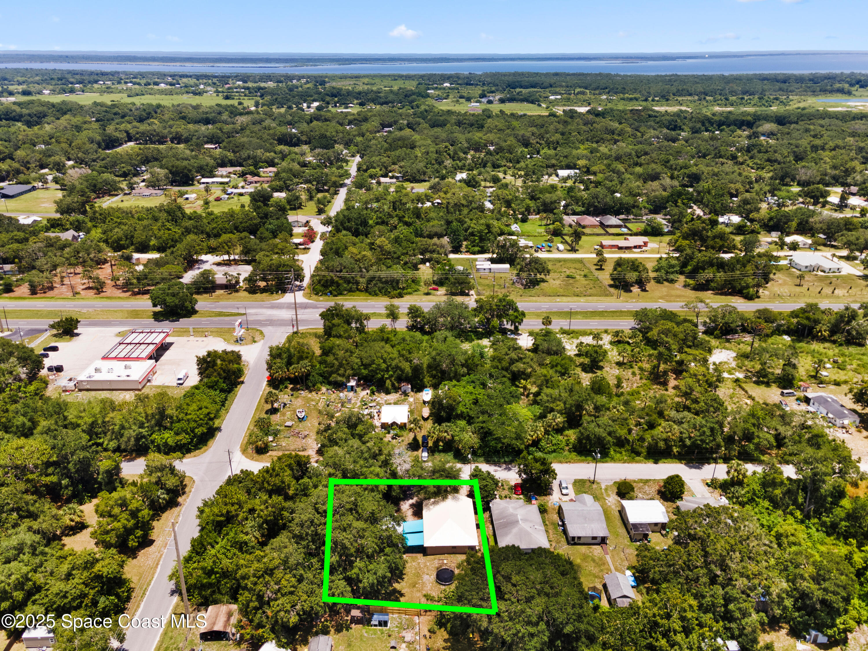 5964 Travis Street Mims, FL 32754 - Photo 43 of 45 an aerial view of residential houses with outdoor space and trees