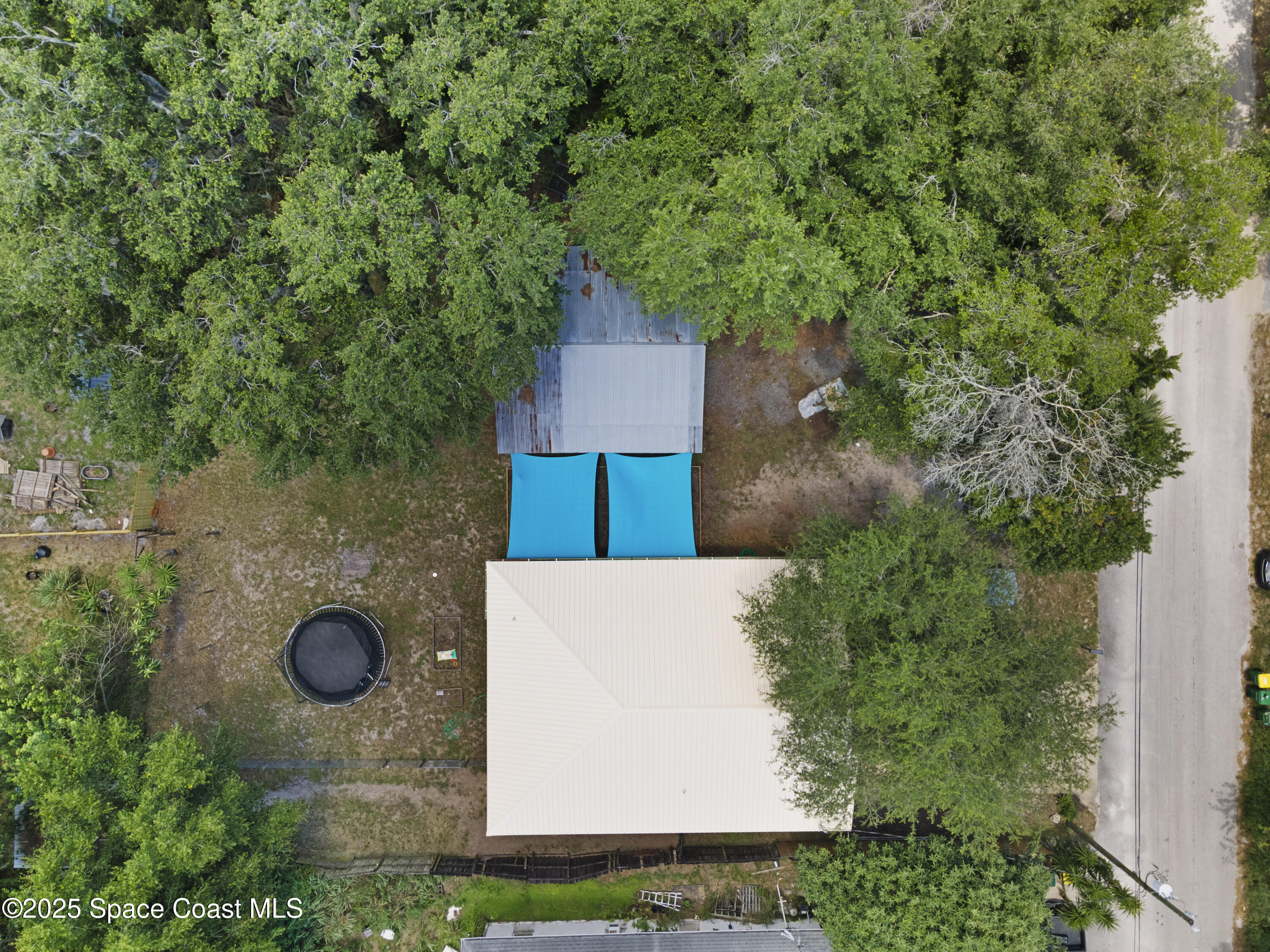 5964 Travis Street Mims, FL 32754 - Photo 45 of 45 an aerial view of a house with yard space and trees all around