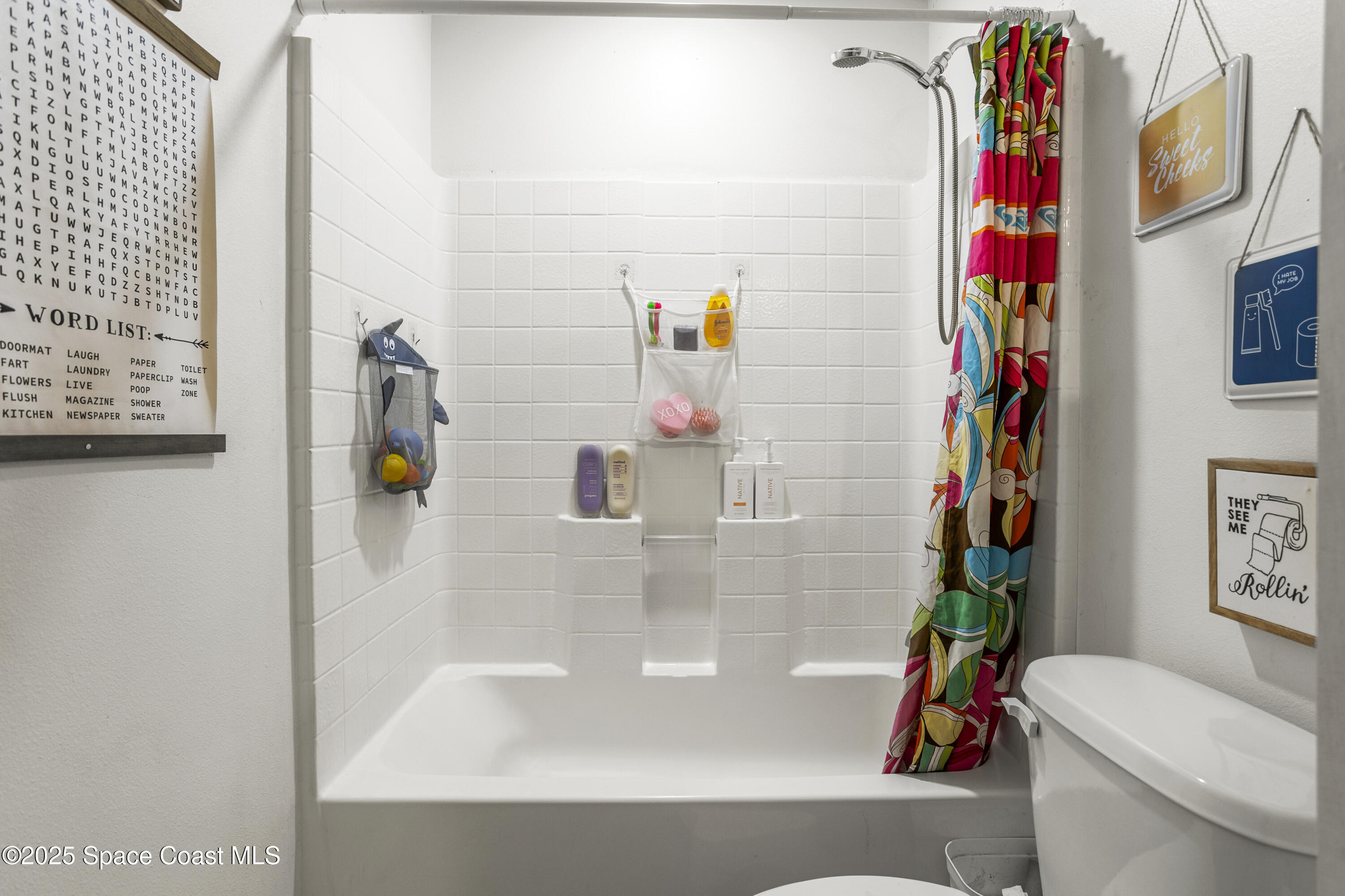 5964 Travis Street Mims, FL 32754 - Photo 10 of 45 a bathroom with a sink mirror vanity and toilet