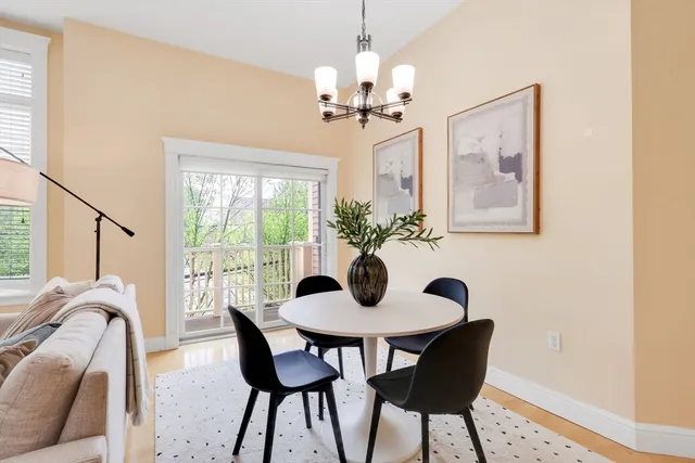 a dining room with furniture and chandelier
