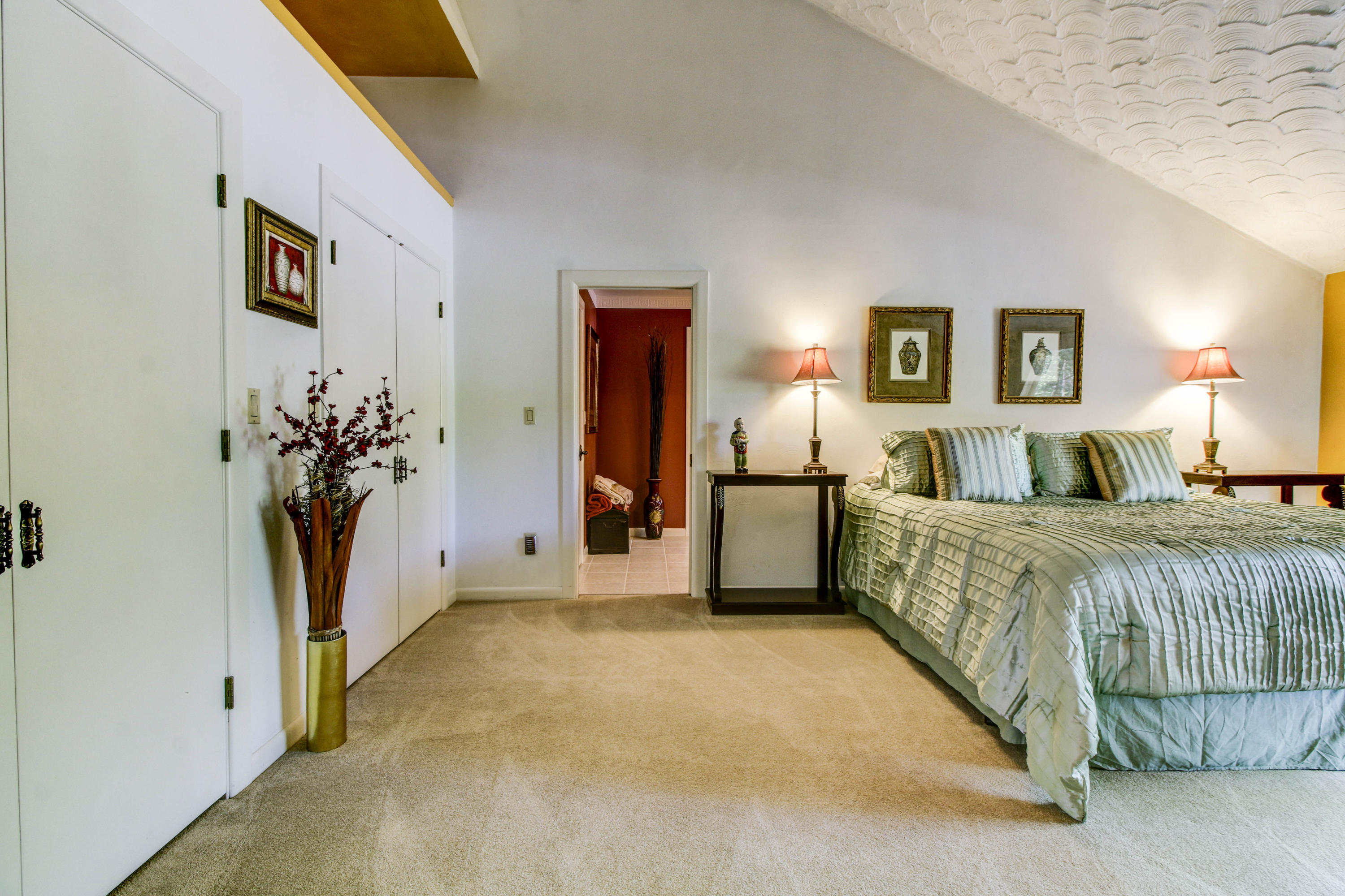 16 Stonehaven Lane Blue Ridge, VA 24064 - Photo 22 of 46 a bedroom with a bed and a painting on the wall