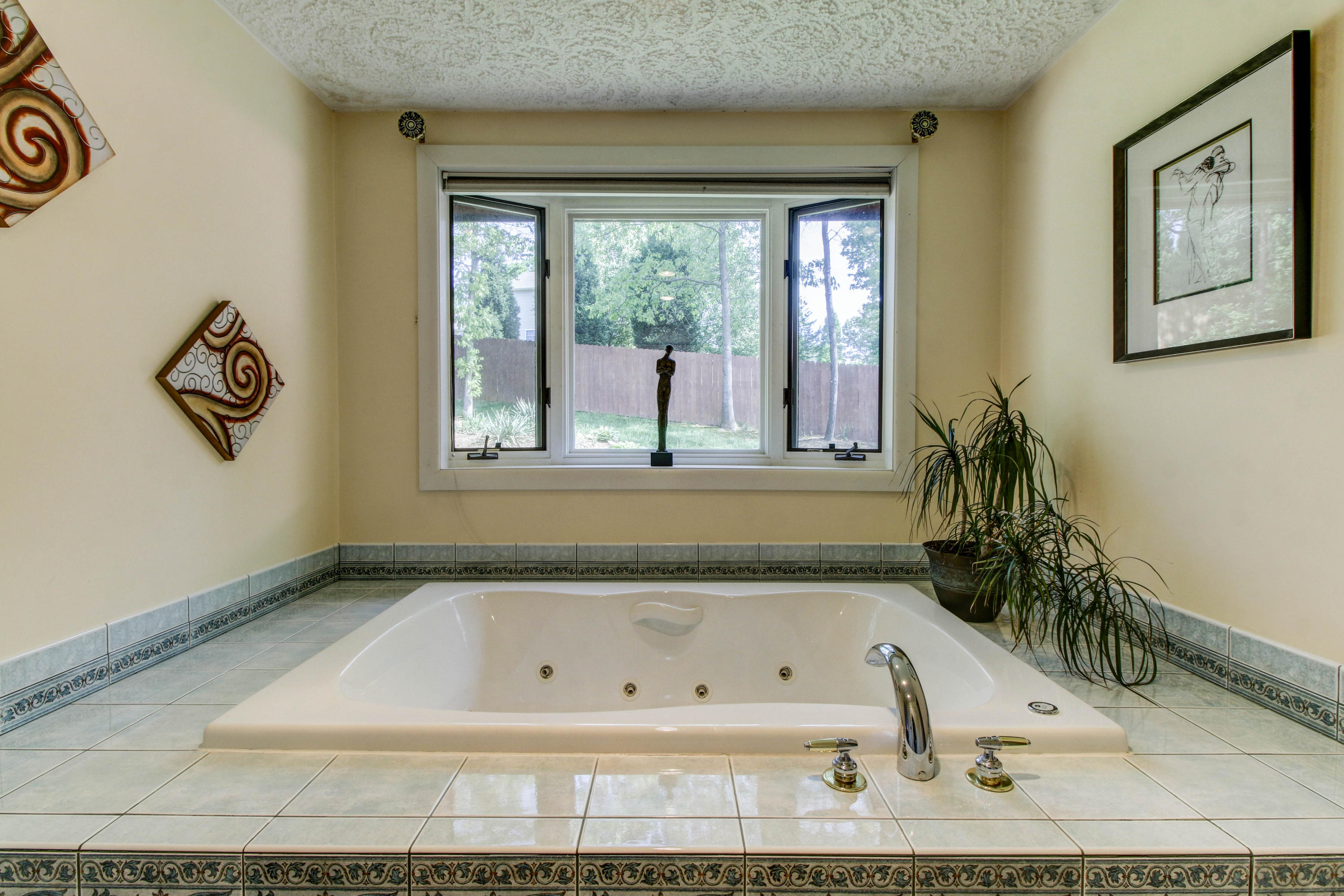 16 Stonehaven Lane Blue Ridge, VA 24064 - Photo 31 of 46 a bathroom with a bathtub and a window