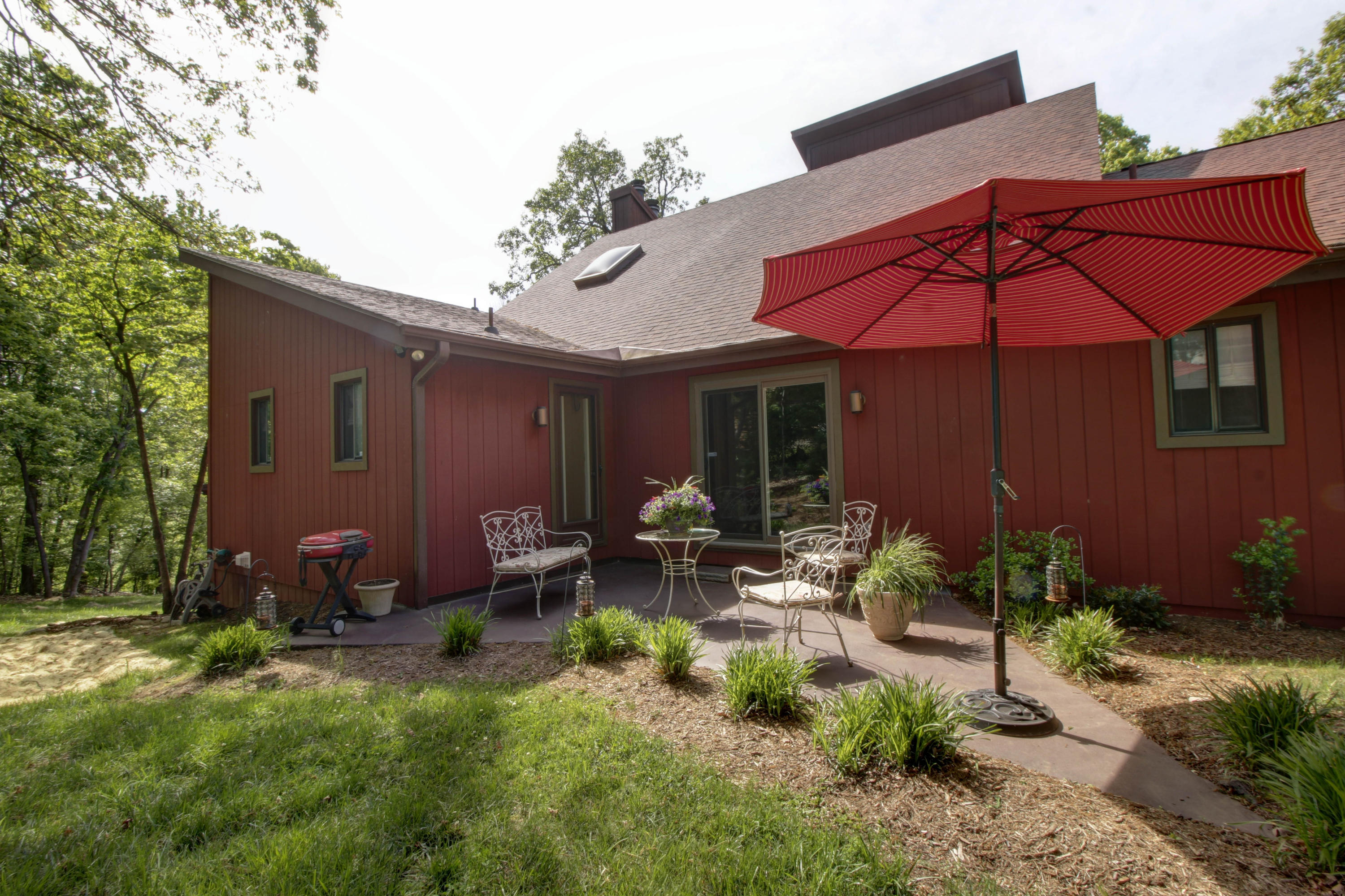 16 Stonehaven Lane Blue Ridge, VA 24064 - Photo 41 of 46 a view of a patio with table and chairs under an umbrella