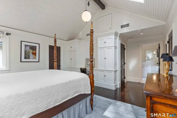 a large white bed in a white room
