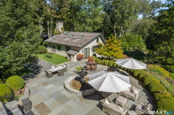 an aerial view of a house having yard patio and backyard