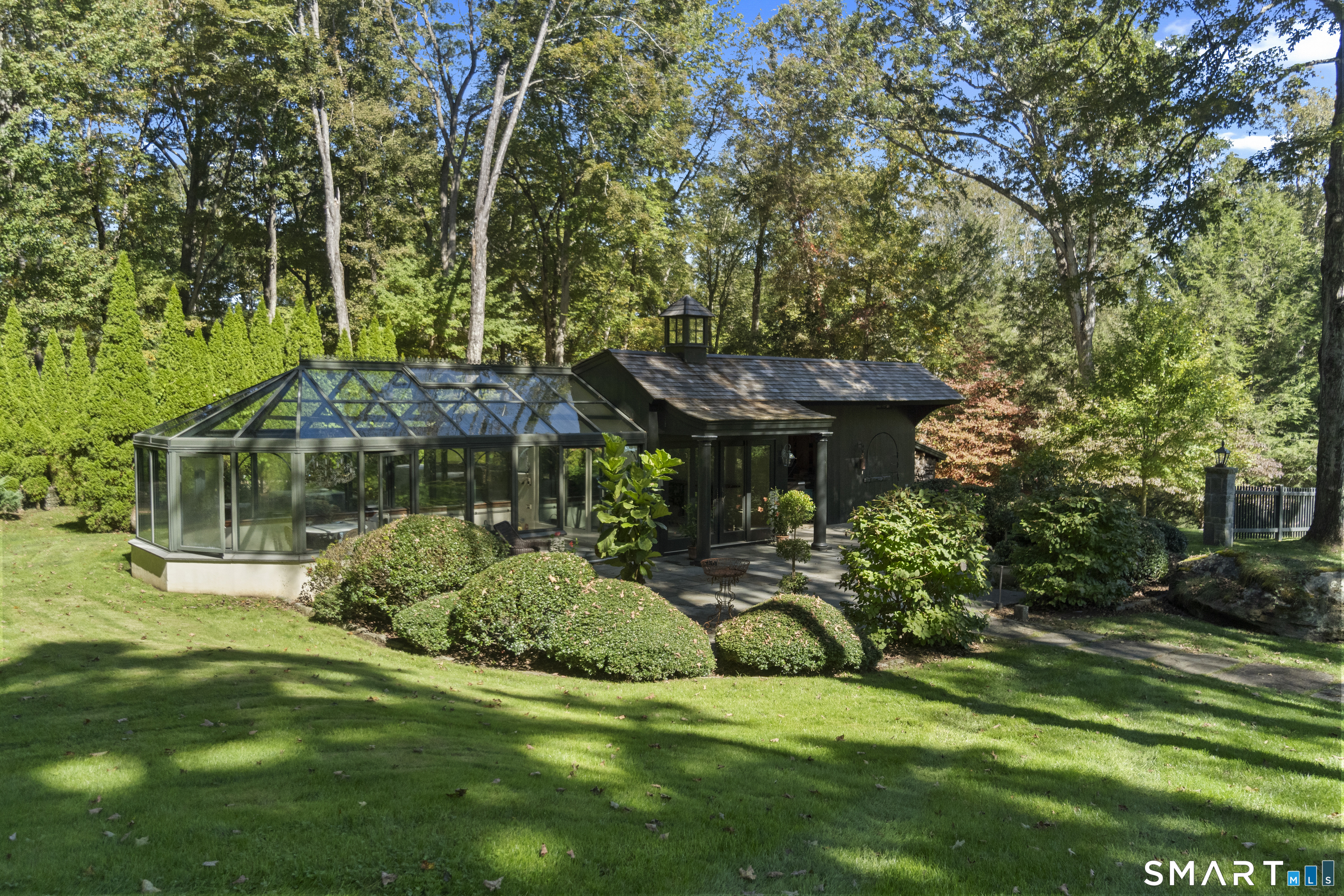 252 River Road Deep River, CT 06417 - Photo 36 of 40 a view of a house with a backyard and a patio