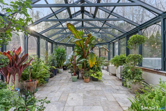 a view of a chair and table in the patio