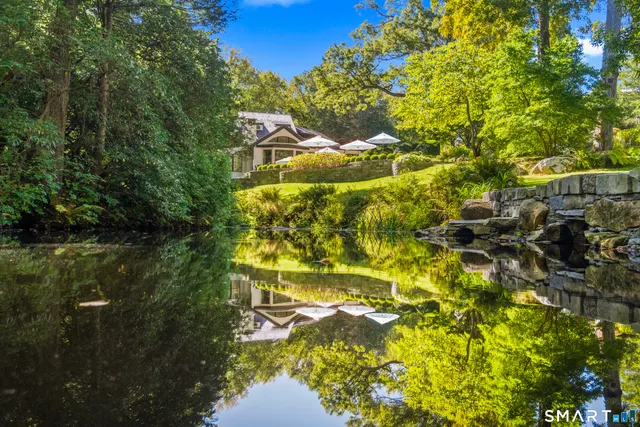 a view of swimming pool from a lake view