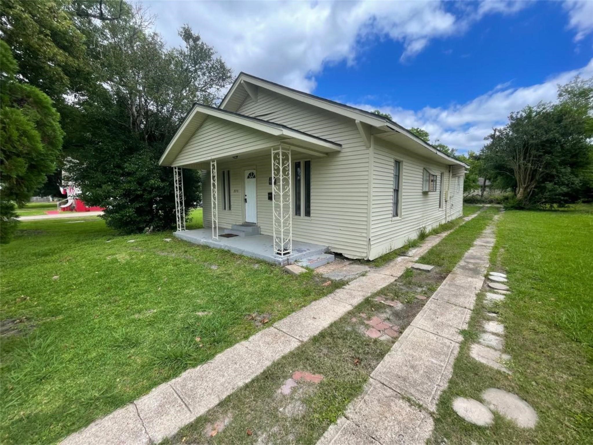 2010 13th Street Port Arthur, TX 77640 - Photo 2 of 22 a view of a house with a yard