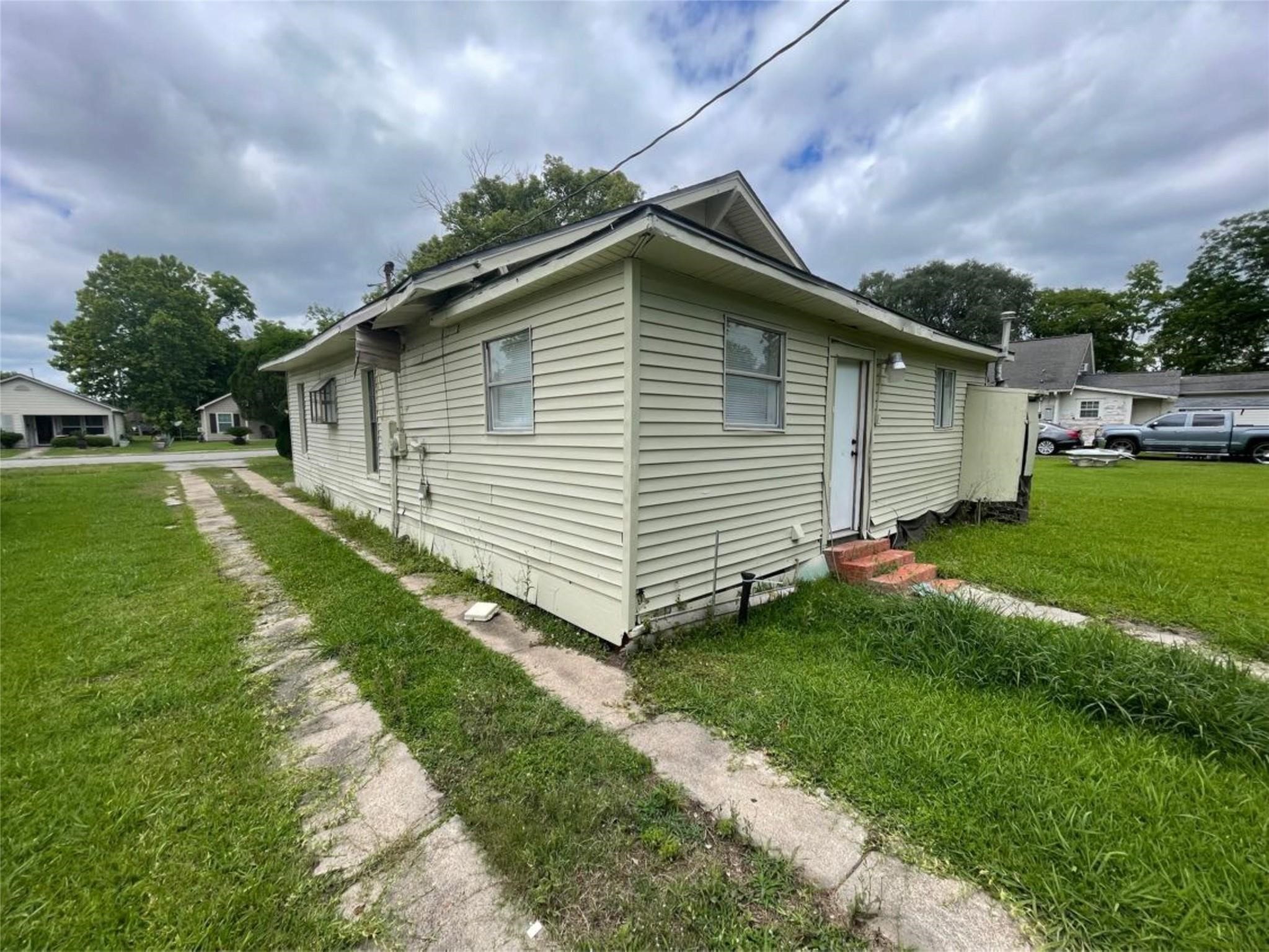 2010 13th Street Port Arthur, TX 77640 - Photo 3 of 22 a front view of house with yard and green space