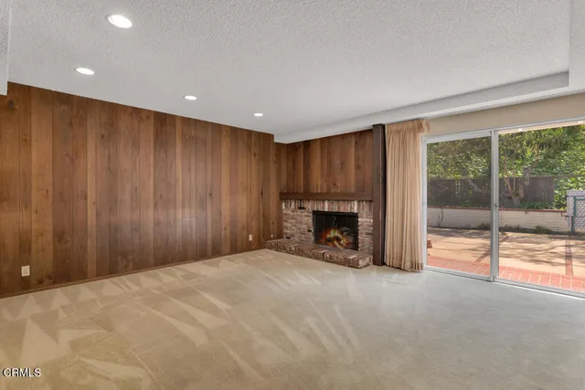 a kitchen with granite countertop a sink and cabinets