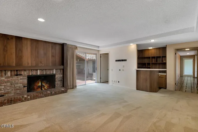a spacious bathroom with a granite countertop sink and a large mirror