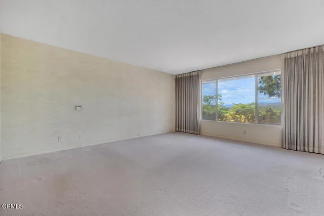 a spacious bathroom with a granite countertop sink a mirror and shower