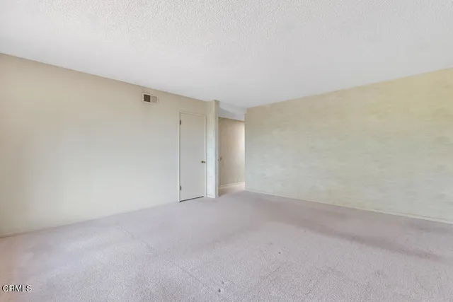 a spacious bathroom with a double vanity sink and a mirror