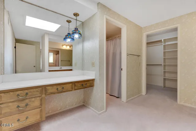 a view of an empty walk in closet