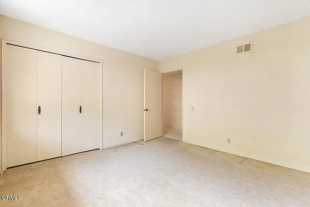 a view of a house with swimming pool and sitting area