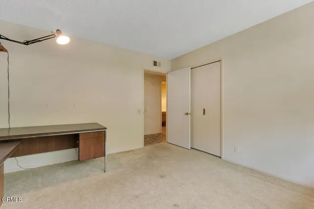 a view of a swimming pool with an outdoor space and seating area