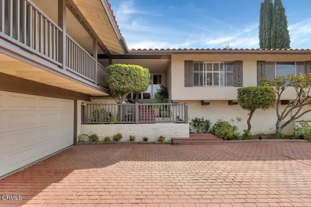 a view of a house with a street