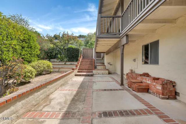 an aerial view of a houses with a lake