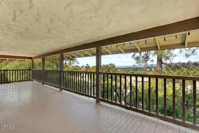 a view of a swimming pool with a yard