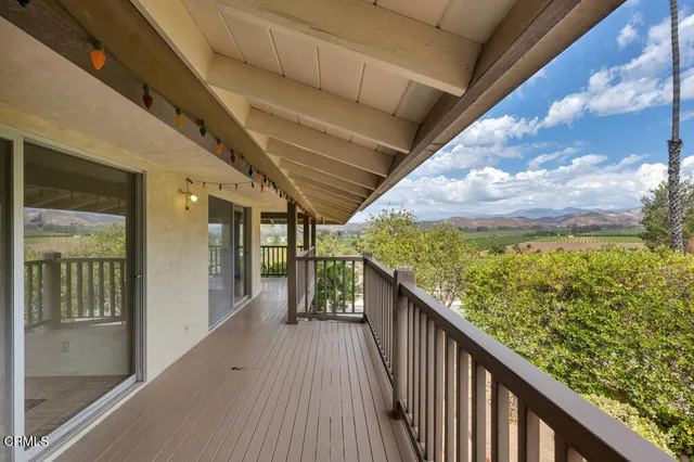 a balcony with an outdoor space