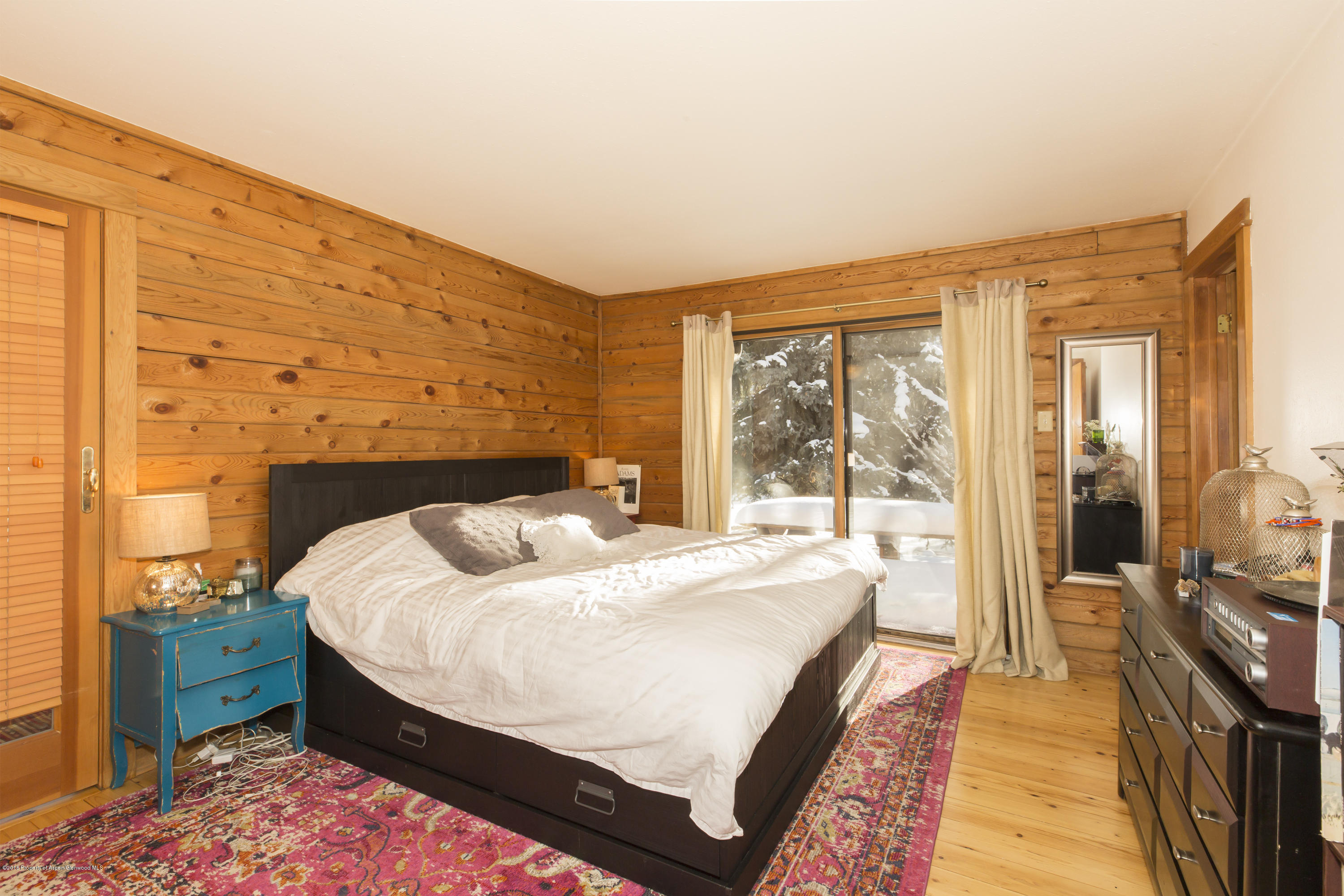 28 Holland Hills Road Basalt, CO 81621 - Photo 6 of 30 a bedroom with a bed and large windows