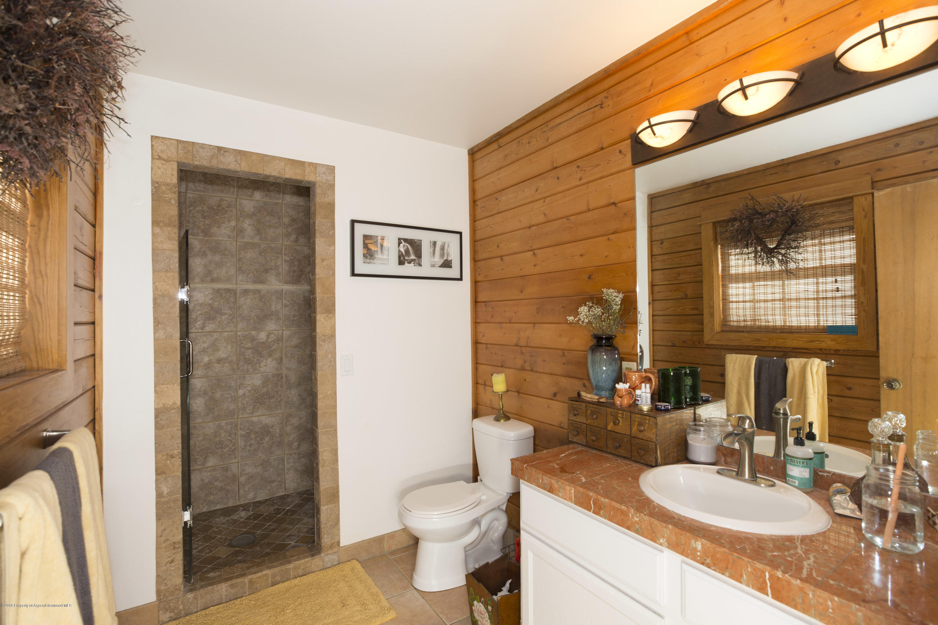 28 Holland Hills Road Basalt, CO 81621 - Photo 7 of 30 a bathroom with a granite countertop sink toilet and shower