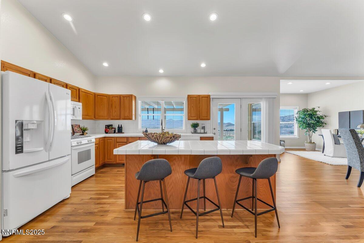 15115 North Red Rock Road Reno, NV 89508 - Photo 11 of 52 a large kitchen with lots of counter space and stainless steel appliances