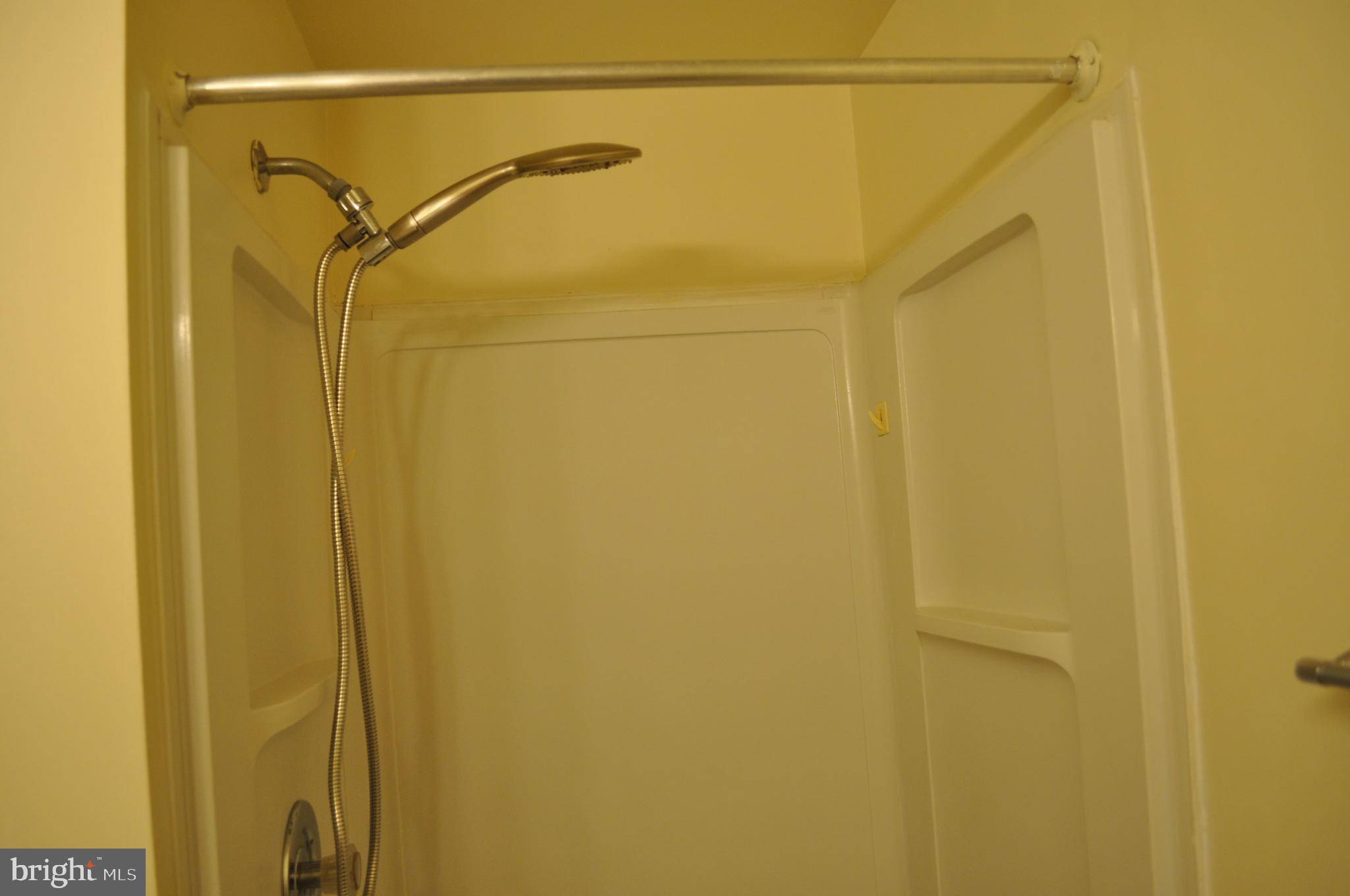 650 Heather Ridge Drive, Unit 12L Frederick, MD 21702 - Photo 14 of 20 a bathroom with a shower