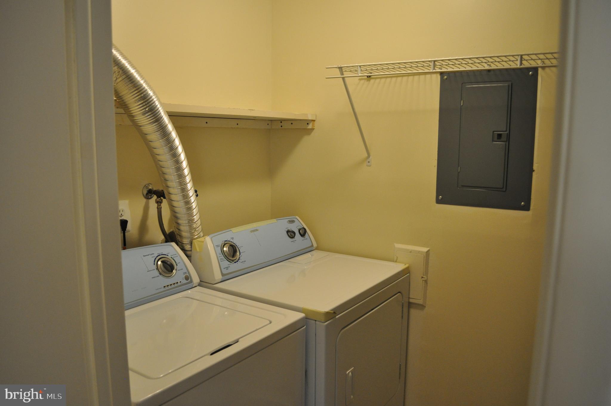 650 Heather Ridge Drive, Unit 12L Frederick, MD 21702 - Photo 17 of 20 a utility room with dryer and washer