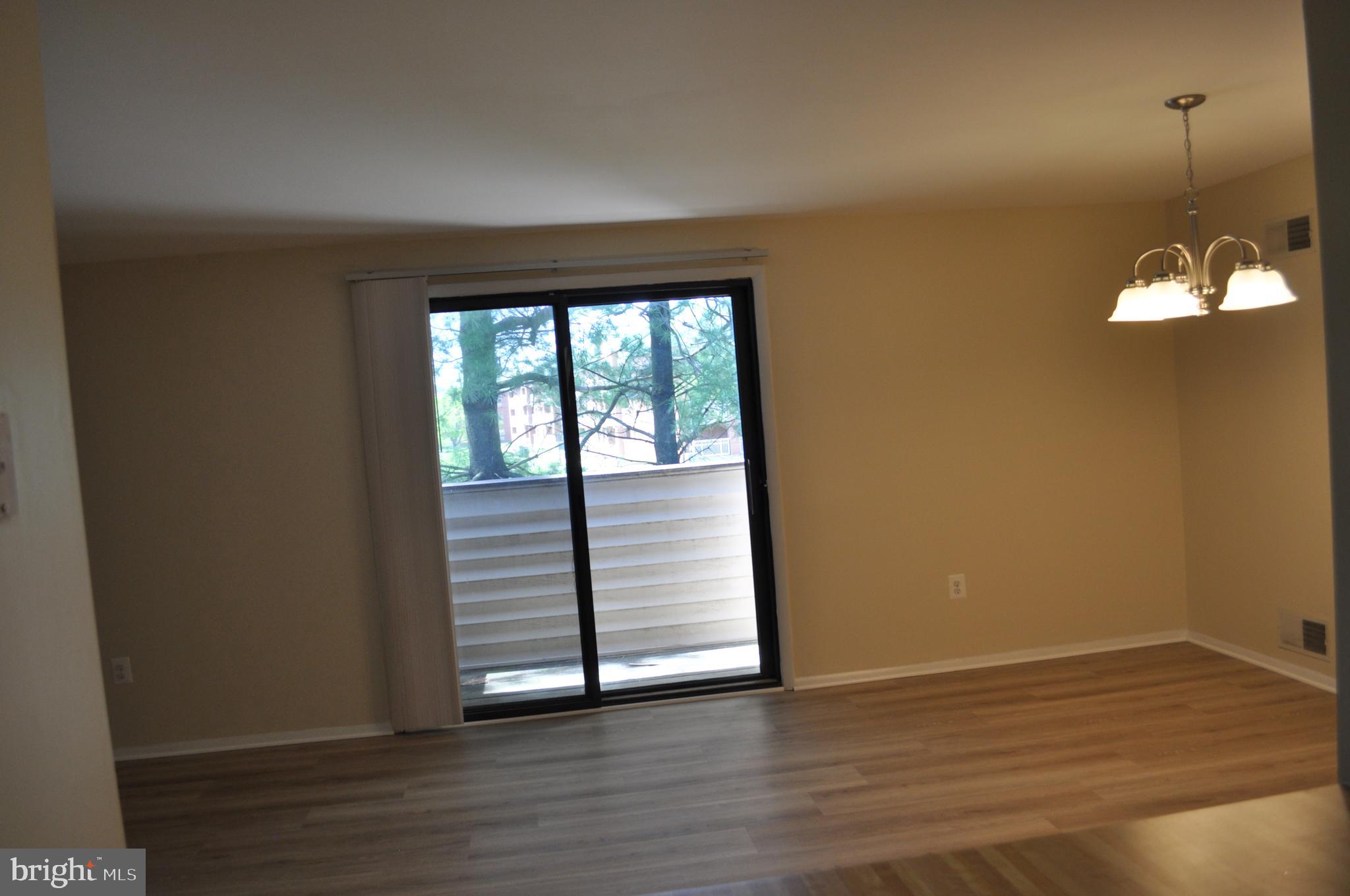 650 Heather Ridge Drive, Unit 12L Frederick, MD 21702 - Photo 7 of 20 a view of a room with wooden floor and window