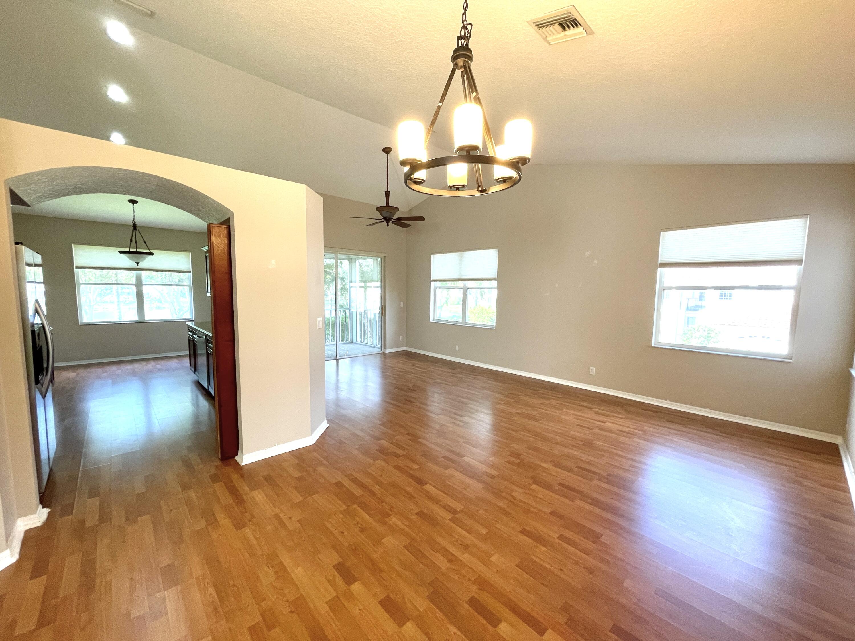 8550 Vía Romana, Unit 2 Boca Raton, FL 33496 - Photo 7 of 28 a view of a livingroom with a chandelier