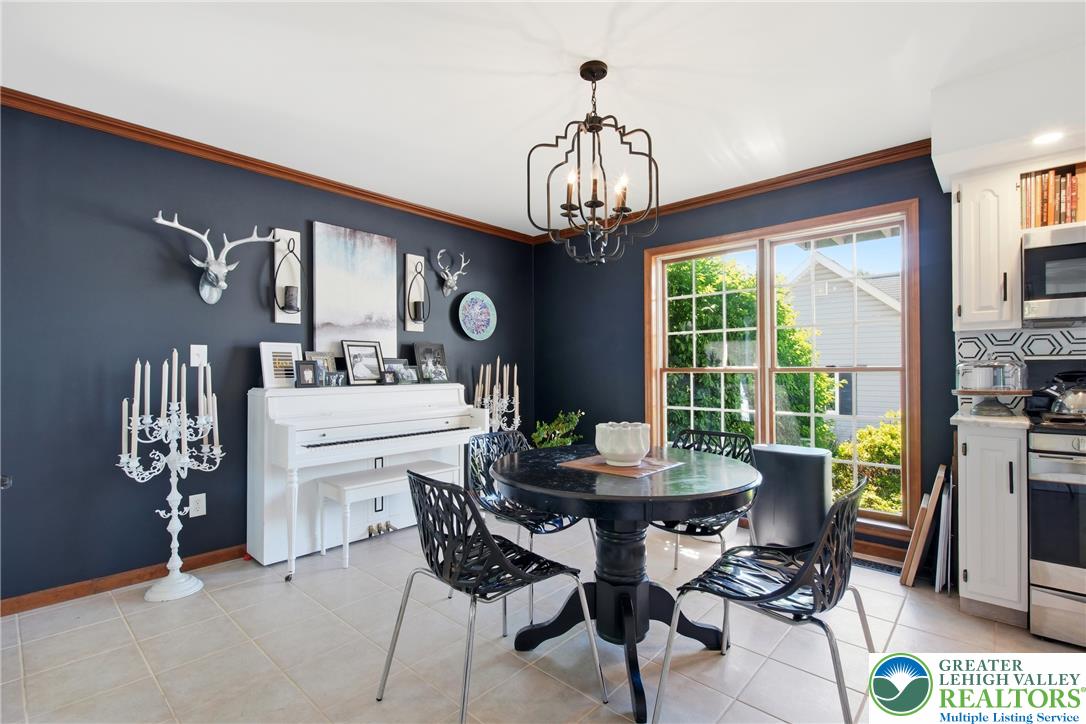 890 Lahr Road Nazareth, PA 18064 - Photo 11 of 71 A well-appointed kitchen dining area, boasting generous window views and classic tile flooring.