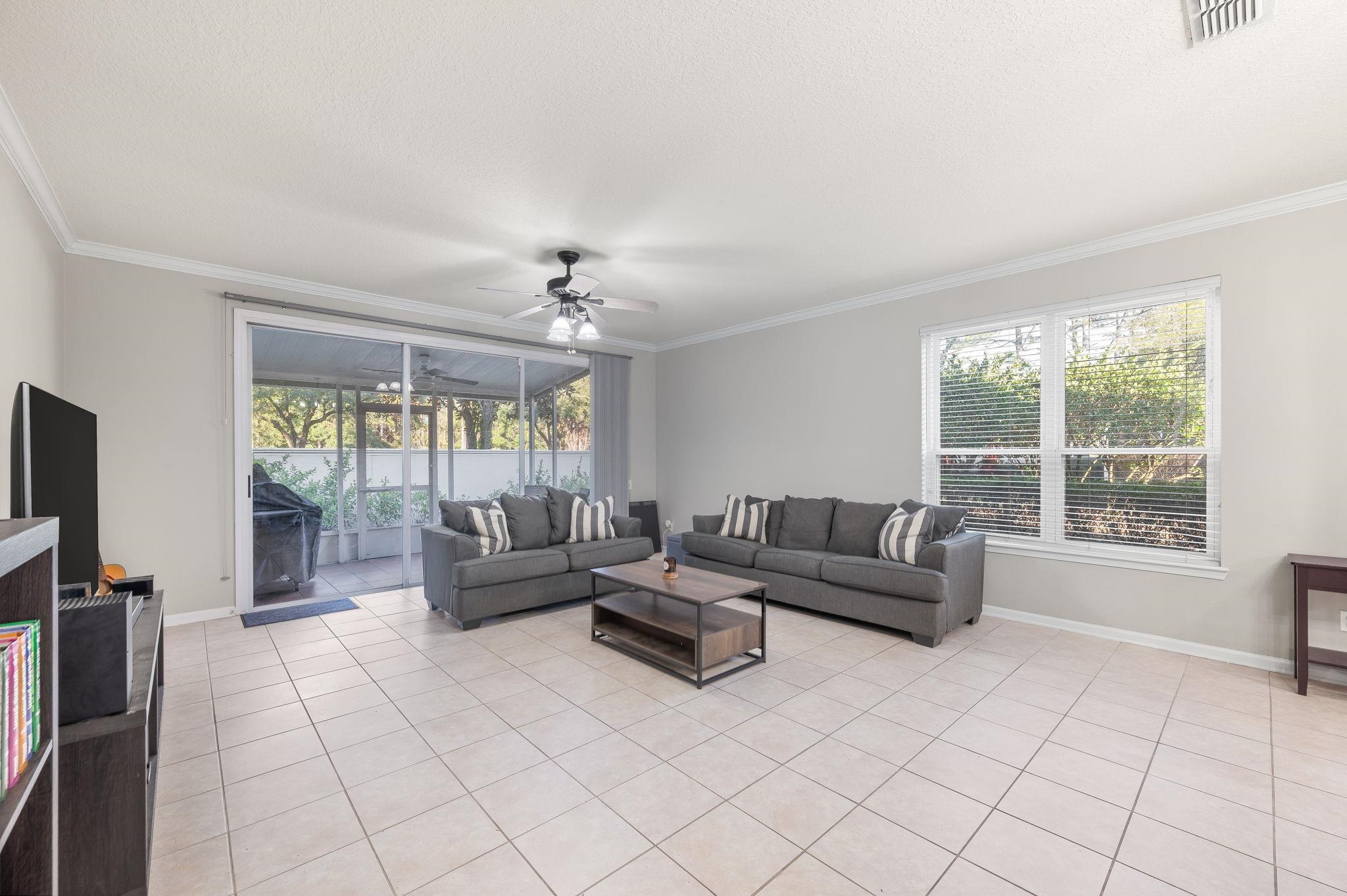 7990 Baymeadows Road East, Unit 1308 Jacksonville, FL 32256 - Photo 15 of 45 a living room with furniture and a flat screen tv